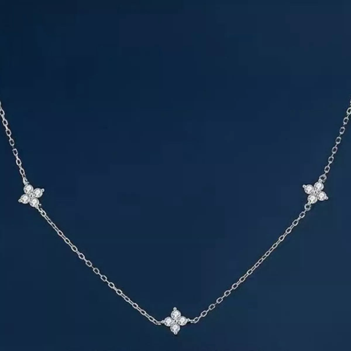 925 Sterling Silver Clover Charm Necklace featuring a delicate heart-shaped pendant on a fine chain.