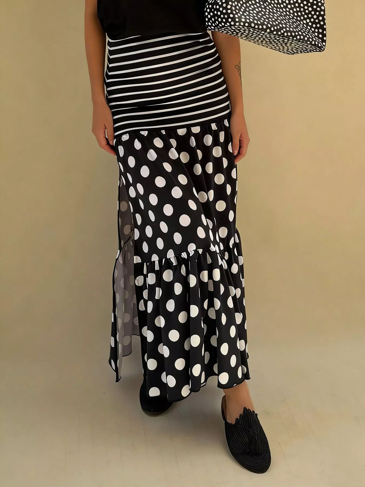 Flowy women’s polka dot and striped maxi skirt by Plush Fashion Hub, featuring a slit and casual bohemian style.