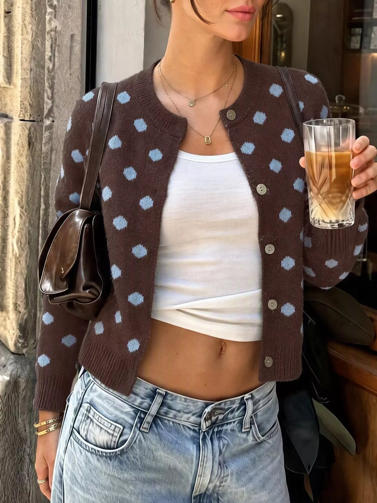 Women’s polka dot button-up cardigan by Trendsi, featuring a classic design with a comfortable fit and stylish pattern.