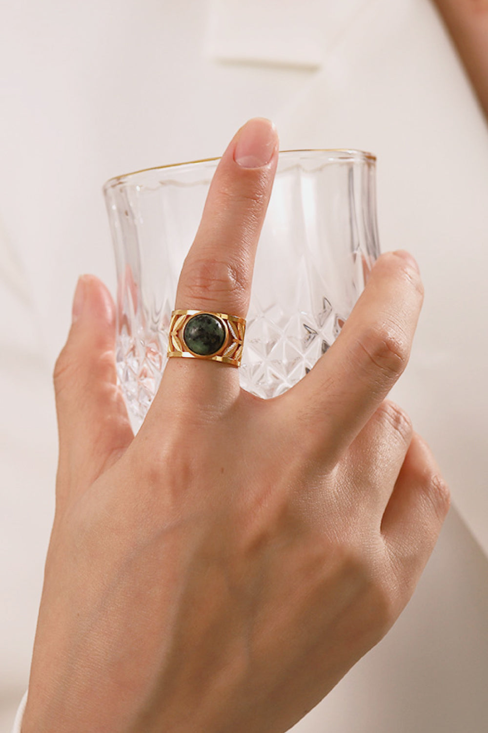 18k gold plated malachite leaf ring with intricate leaf design, showcasing vibrant green gemstone on a stylish ring band.