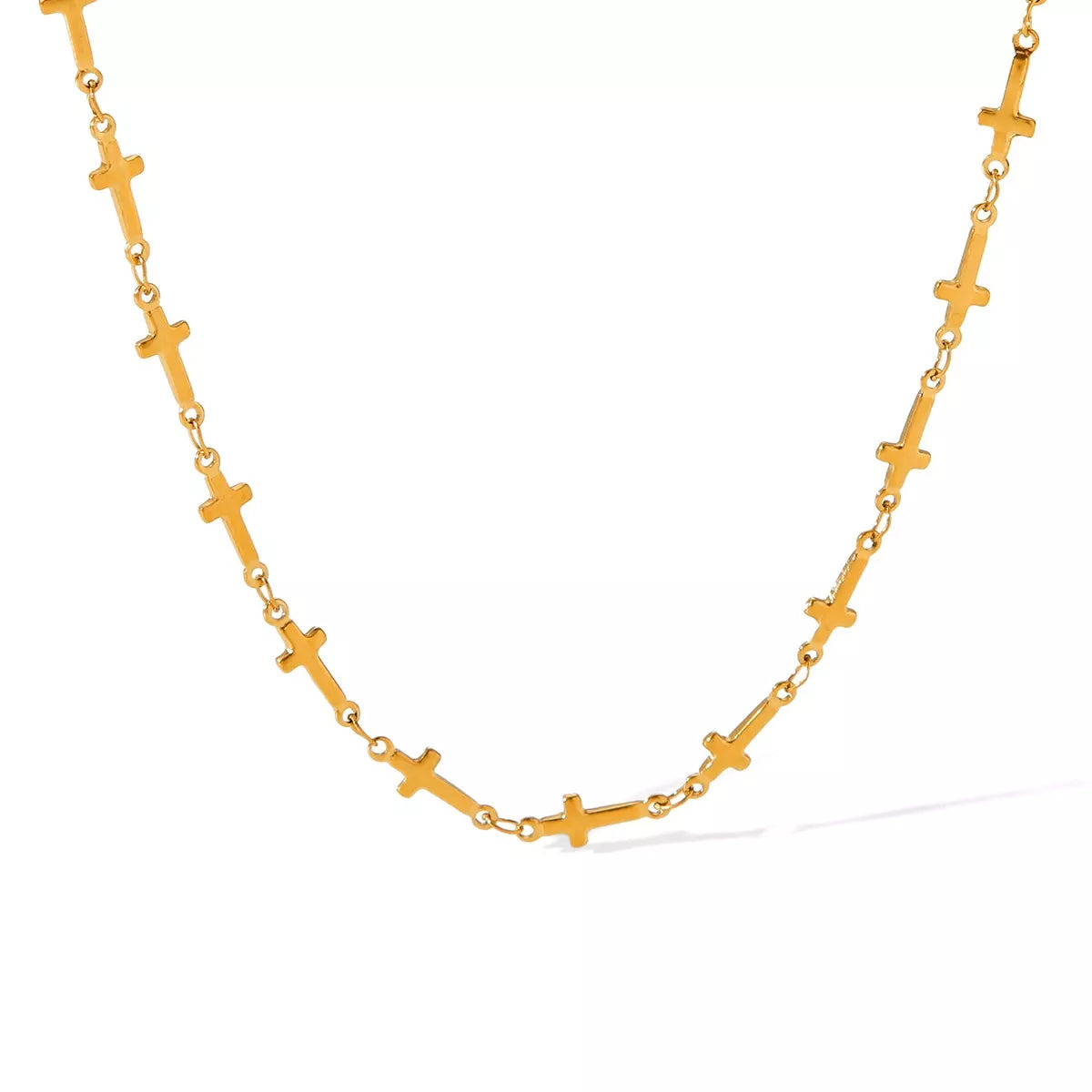 Gold-plated cross necklace from Plush Fashion Hub with a delicate chain and detailed cross pendant, perfect for everyday wear.