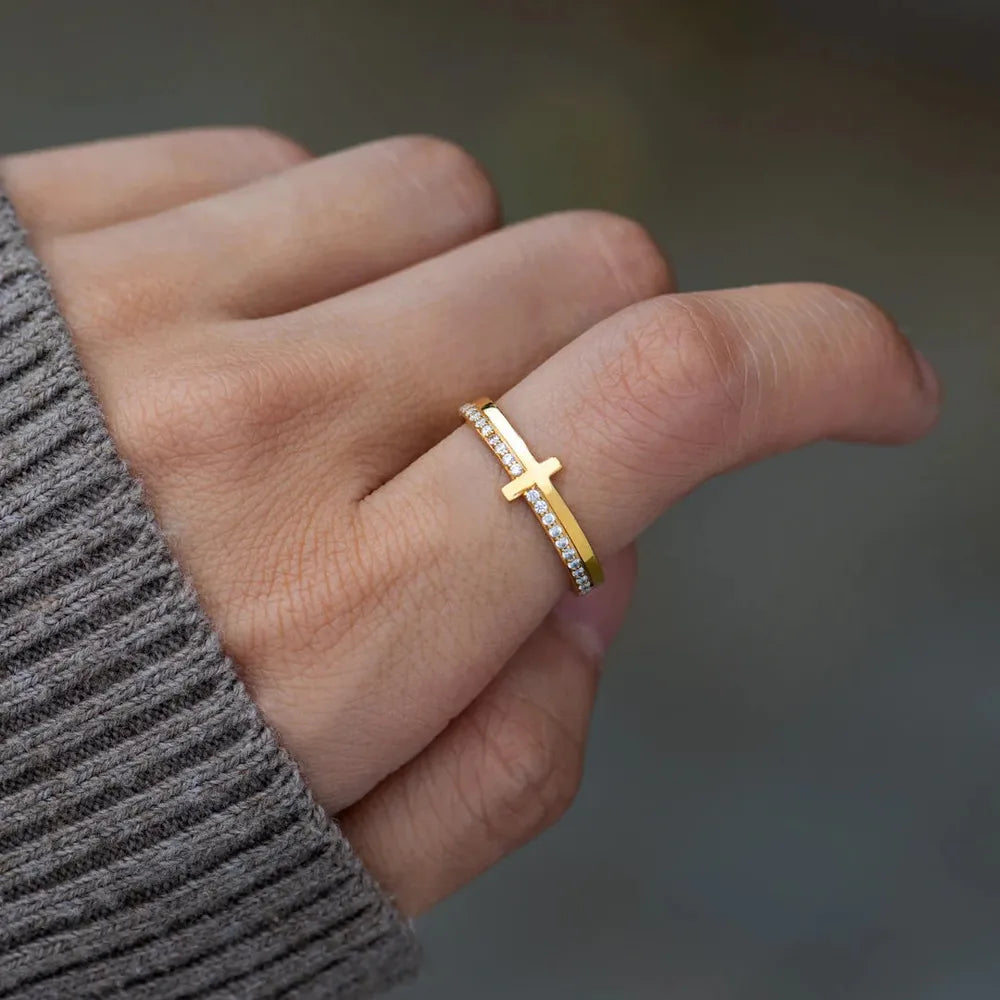 Sterling silver cross ring from Plush Fashion Hub featuring a detailed cross design on a sleek band.