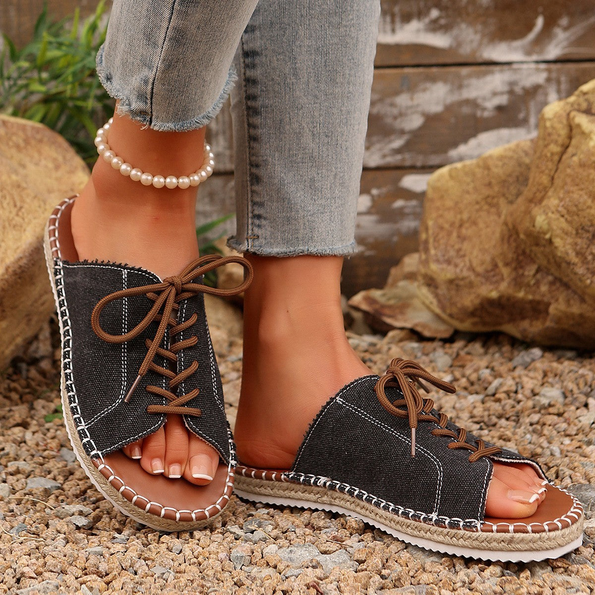 Women’s faux leather lace-up open toe flat sandals by Plush Fashion Hub, showing stylish straps and open toe design.