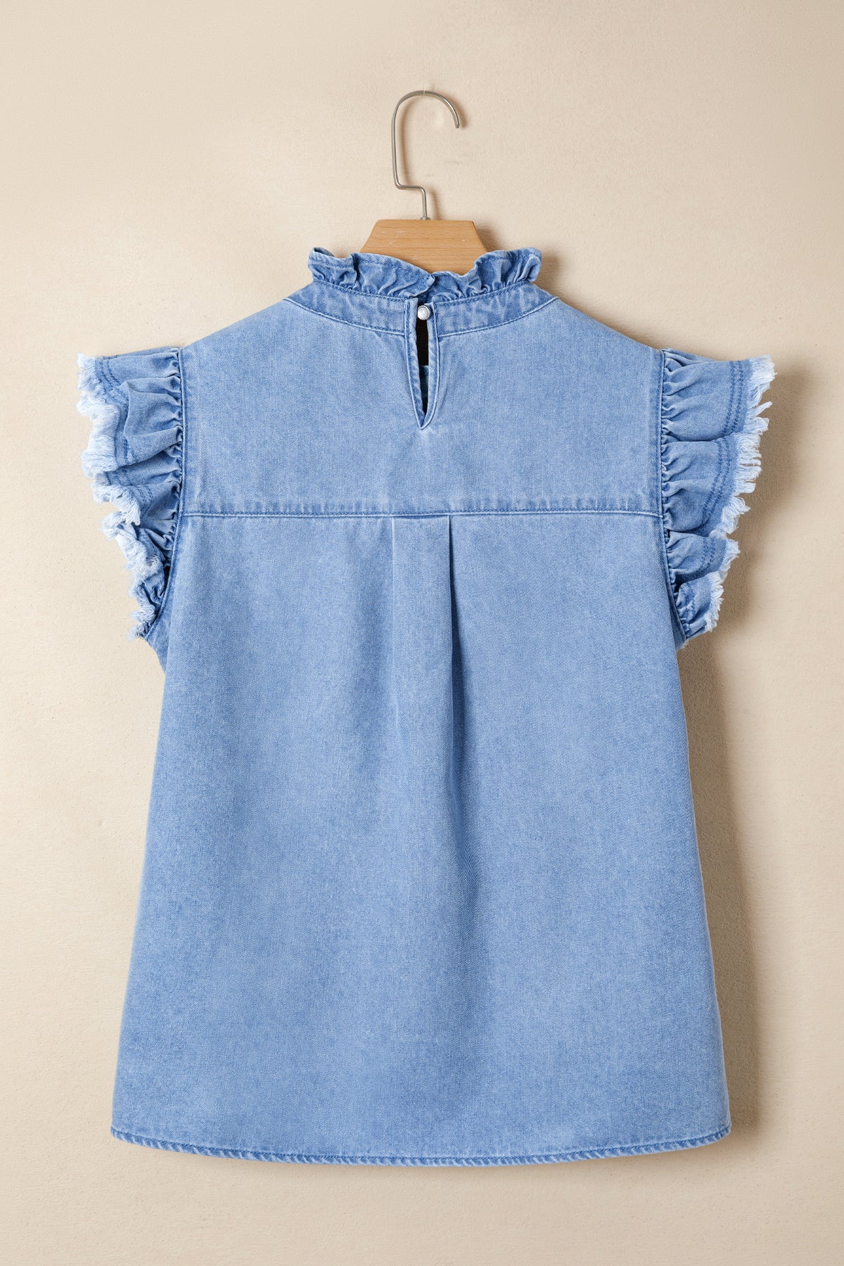 Women's distressed denim top with frilled collar and flutter sleeves by Plush Fashion Hub, featuring a casual stylish design.