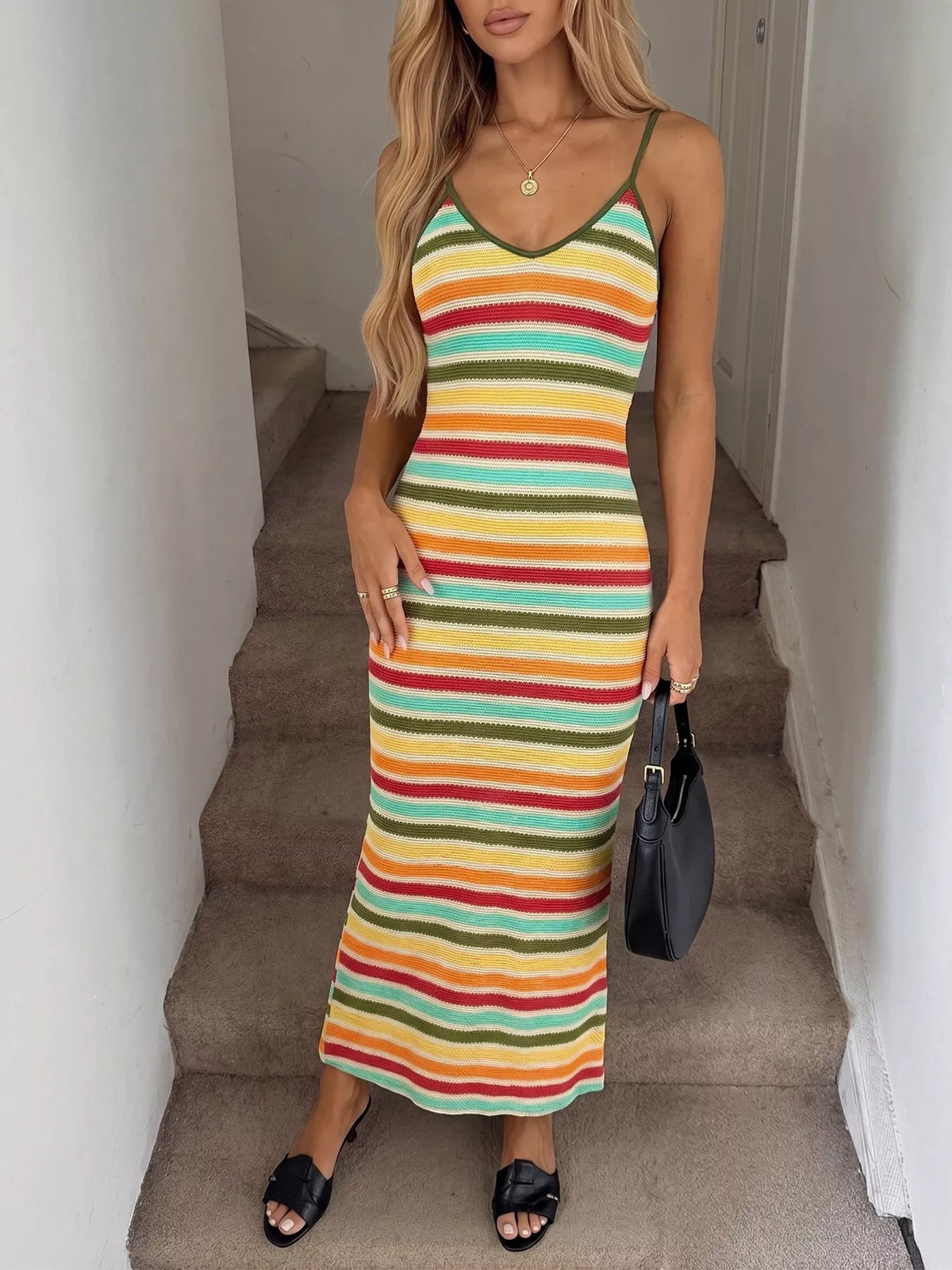 Striped Plush Fashion Hub bodycon knit midi dress featuring a fitted silhouette and bold stripe pattern, perfect for stylish occasions.