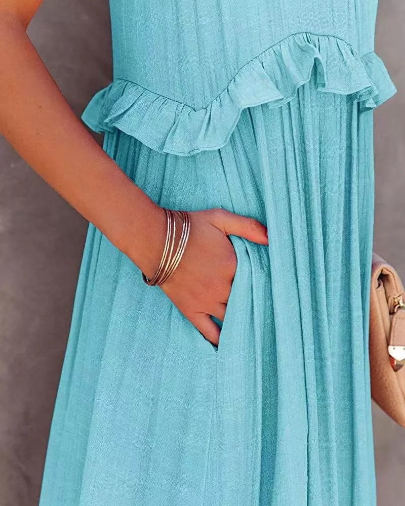 Sleeveless ruffled tiered maxi dress by Plush Fashion Hub, flowing fabric with layered ruffles for a stylish summer look.
