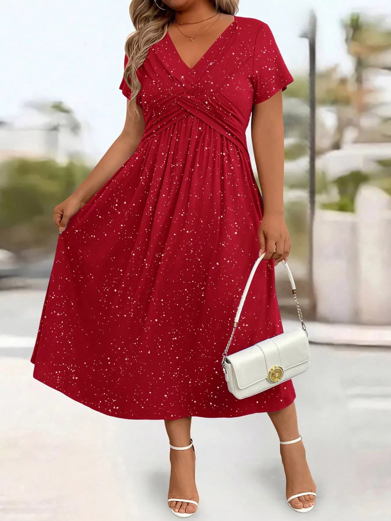 Plus size glitter flutter sleeve midi dress by Trendsi, showcasing a full-length dress with shimmering fabric and flutter sleeves.