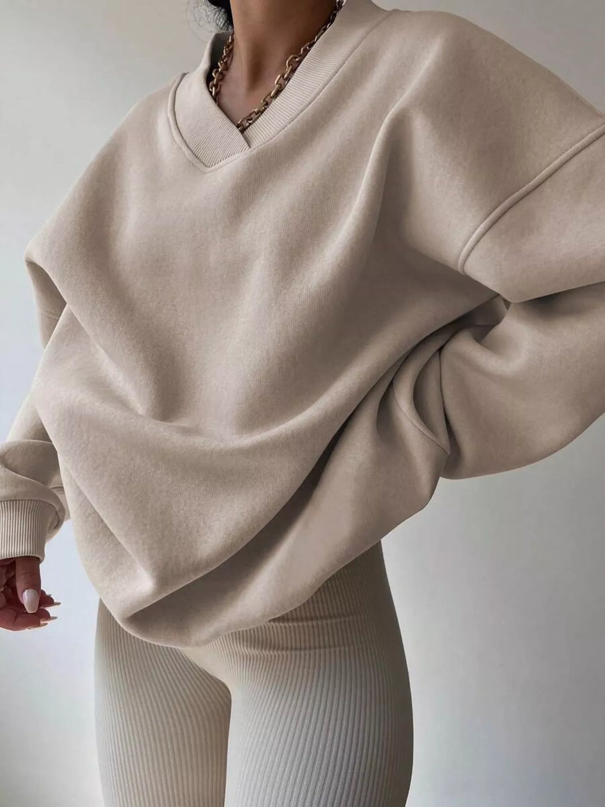 Oversized dropped shoulder long sleeve sweatshirt from Trendsi, featuring a relaxed fit and soft fabric, in a stylish casual design.