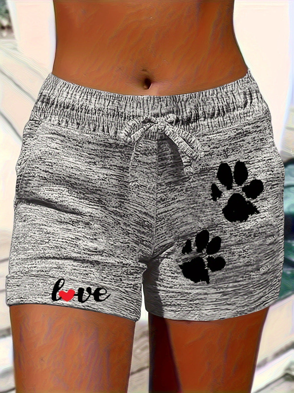 Women’s printed elastic waist cropped shorts with pockets from Plush Fashion Hub, casualwear featuring a colorful design and comfortable fit.