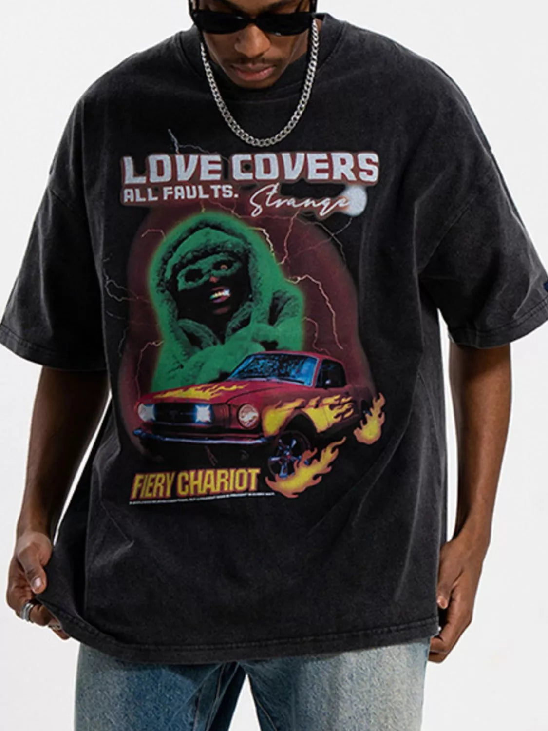 Men's graphic round neck short sleeve T-shirt by Trendsi featuring bold printed design and comfortable fit.