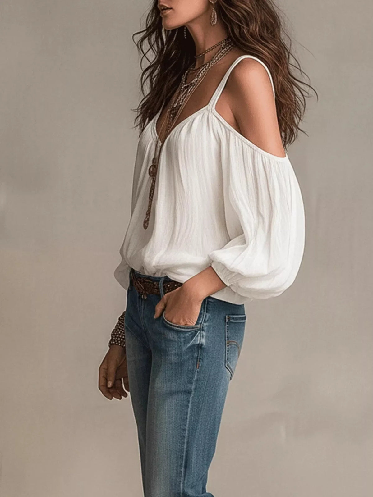 Cold shoulder balloon sleeve blouse by Plush Fashion Hub, featuring stylish cut-outs and voluminous sleeves in soft fabric.