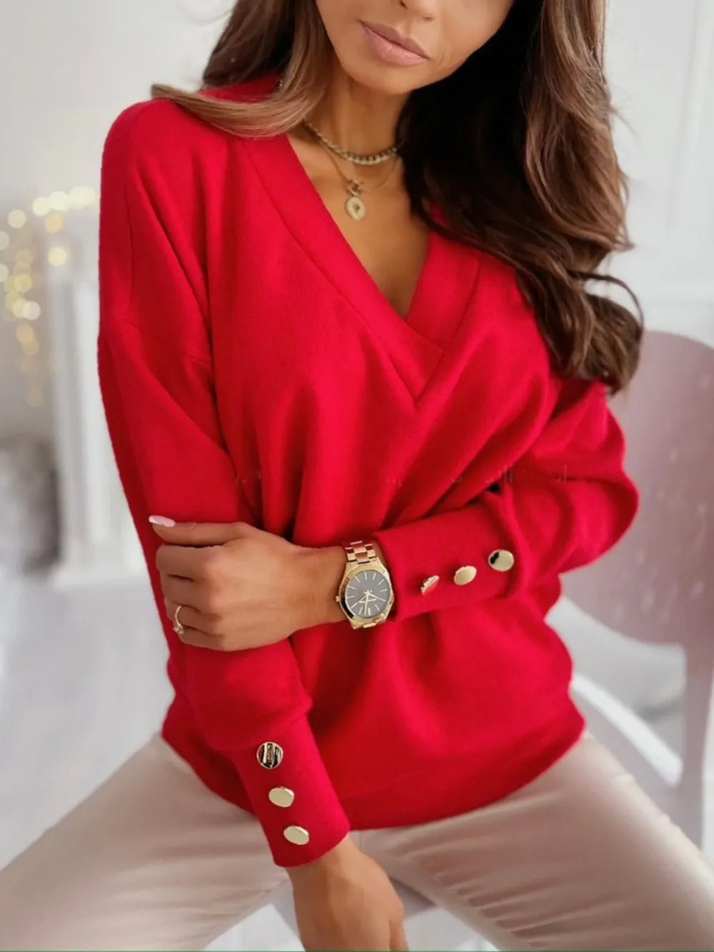 V-neck long sleeve sweatshirt by Trendsi, featuring a comfortable fit and soft fabric in a neutral color.