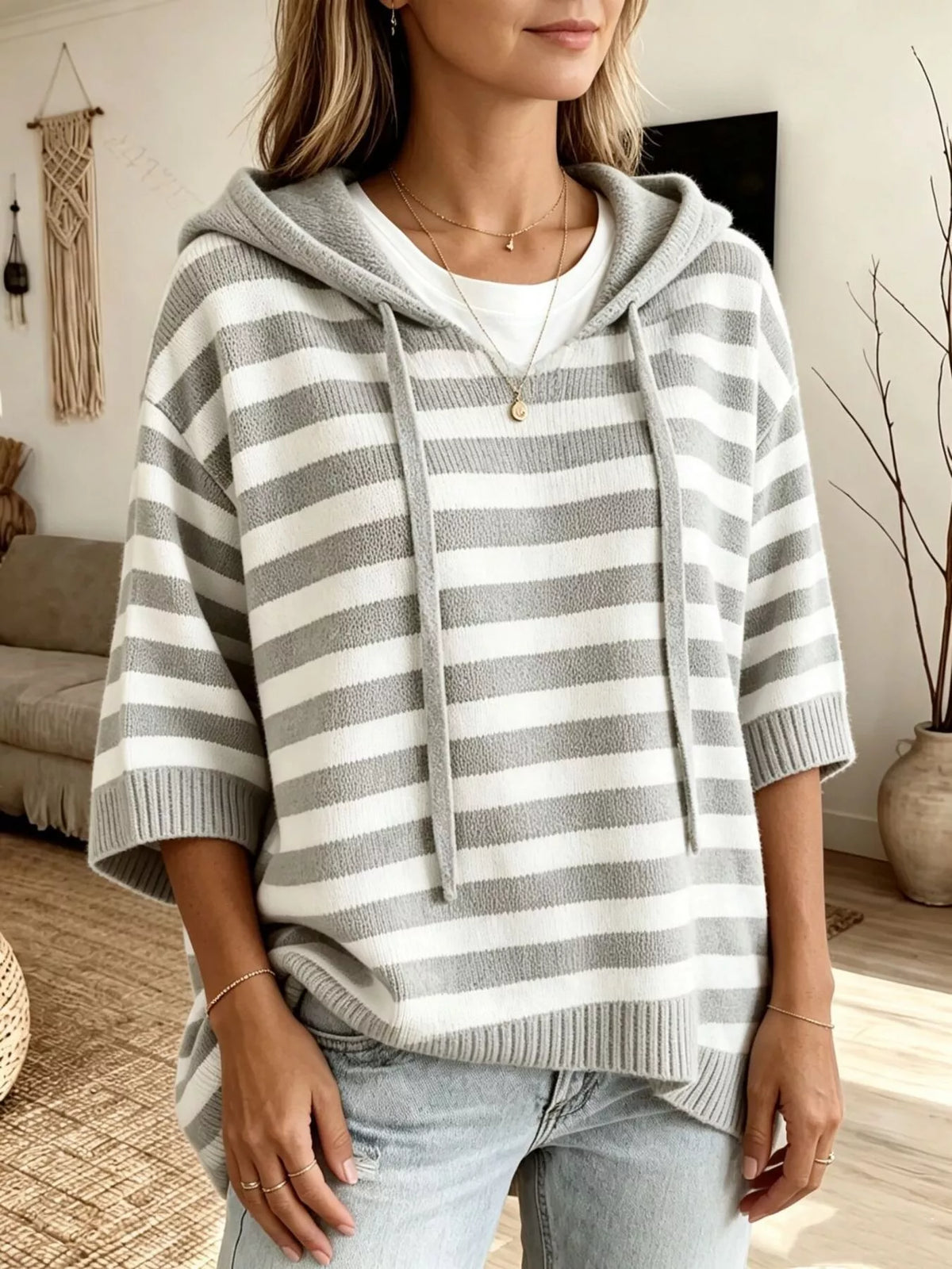 Plus size striped hooded sweater with drawstring closure by Trendsi, featuring full-length sleeves and a casual, comfortable fit.