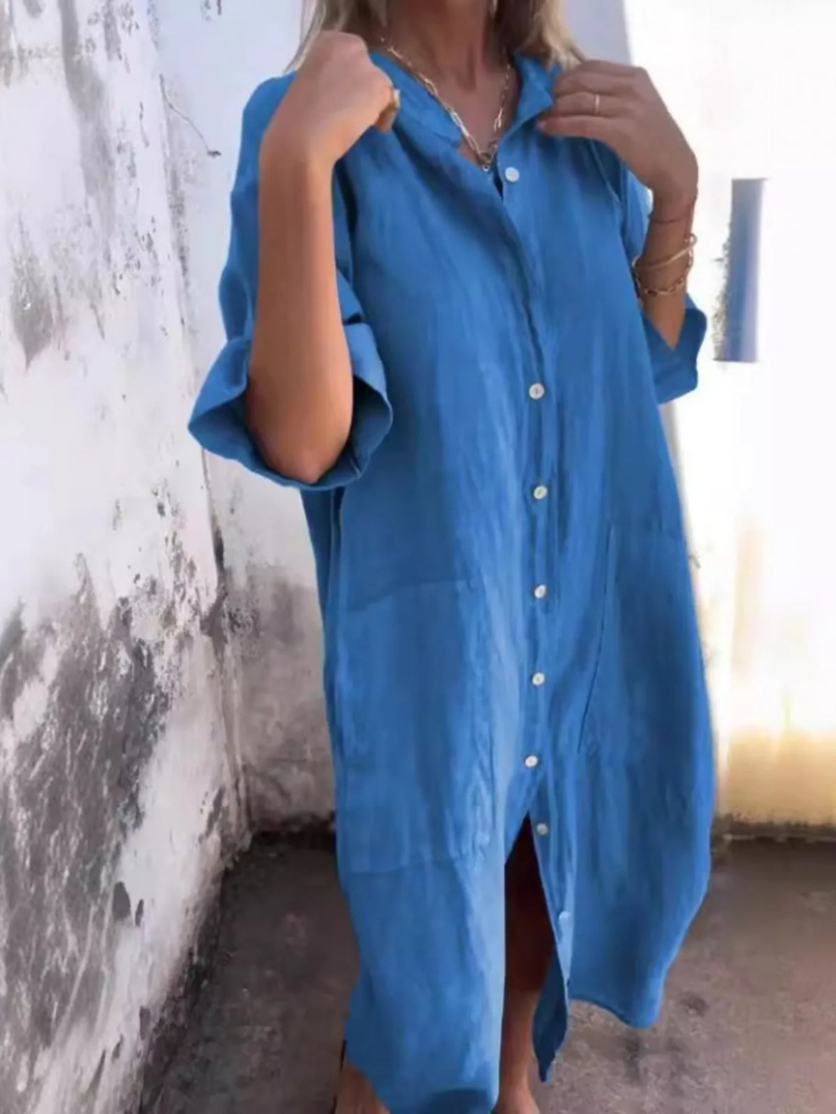 Plus size casual linen button-down shirt dress by Trendsi, featuring a relaxed fit and lightweight fabric, shown on a model.