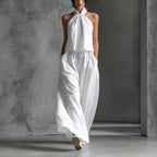 Women's loose sleeveless top and high-waist wide-leg pants set by FitiqueFit in four colors, casualwear style, front view.