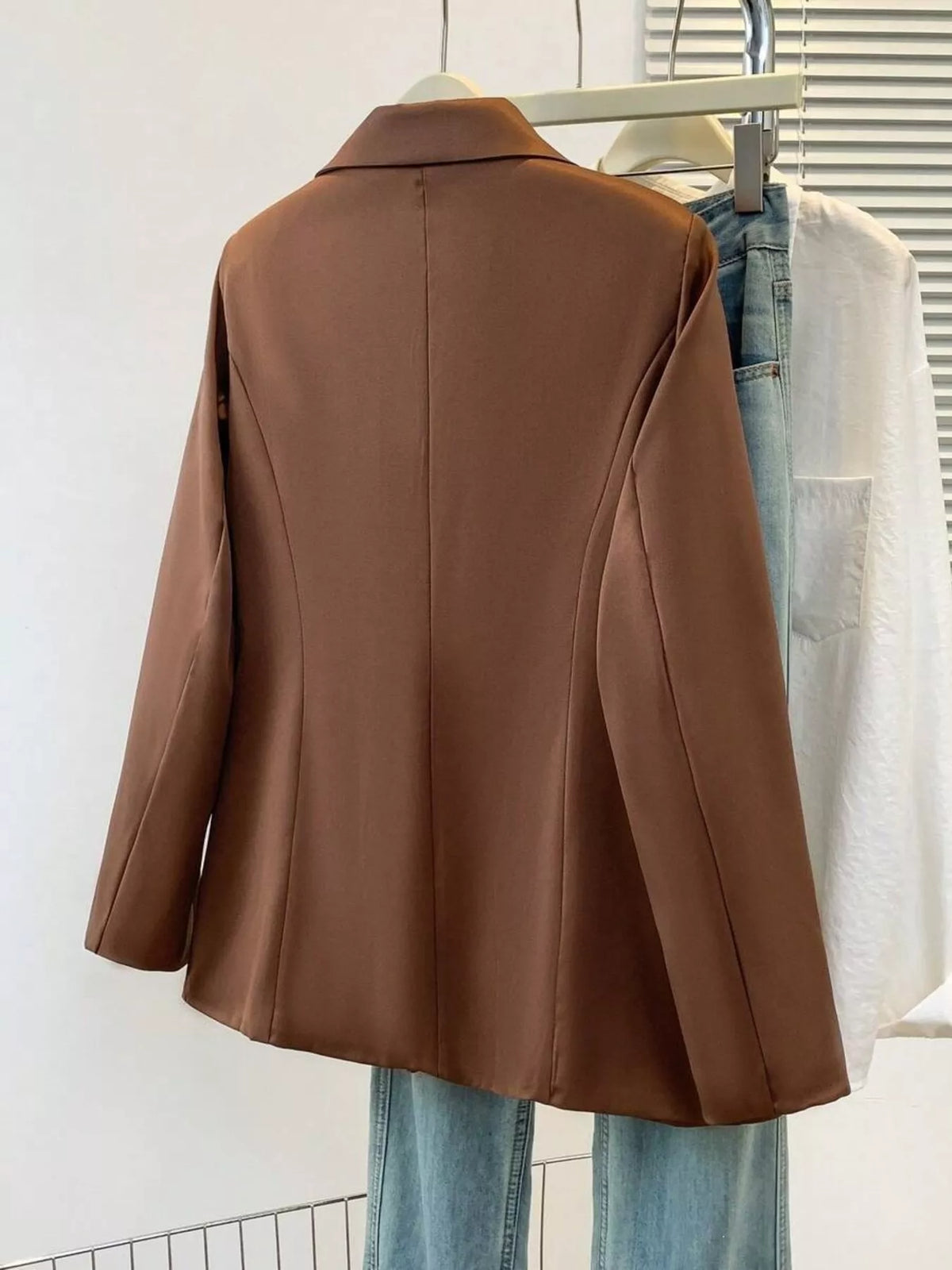 Plus size casual blazer with lapel collar, single-breasted style from Trendsi, shown in a full front view.