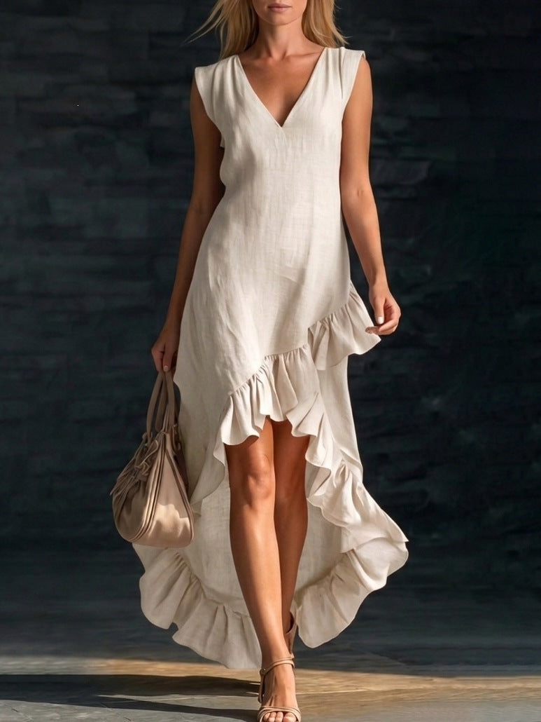 Women's sleeveless V-neck ruffle hem maxi dress in cotton linen by FitiqueFit, shown in a casual outdoor setting.