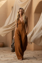 Women's linen-look V-neck jumpsuit by Plush Fashion Hub featuring a textured sleeveless design perfect for commuter style.
