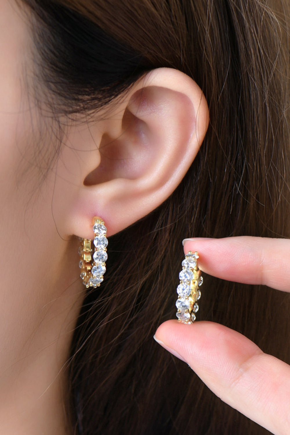 Sterling silver moissanite earrings with 7.2 carats, featuring sparkling gemstones and a classic hoop design.