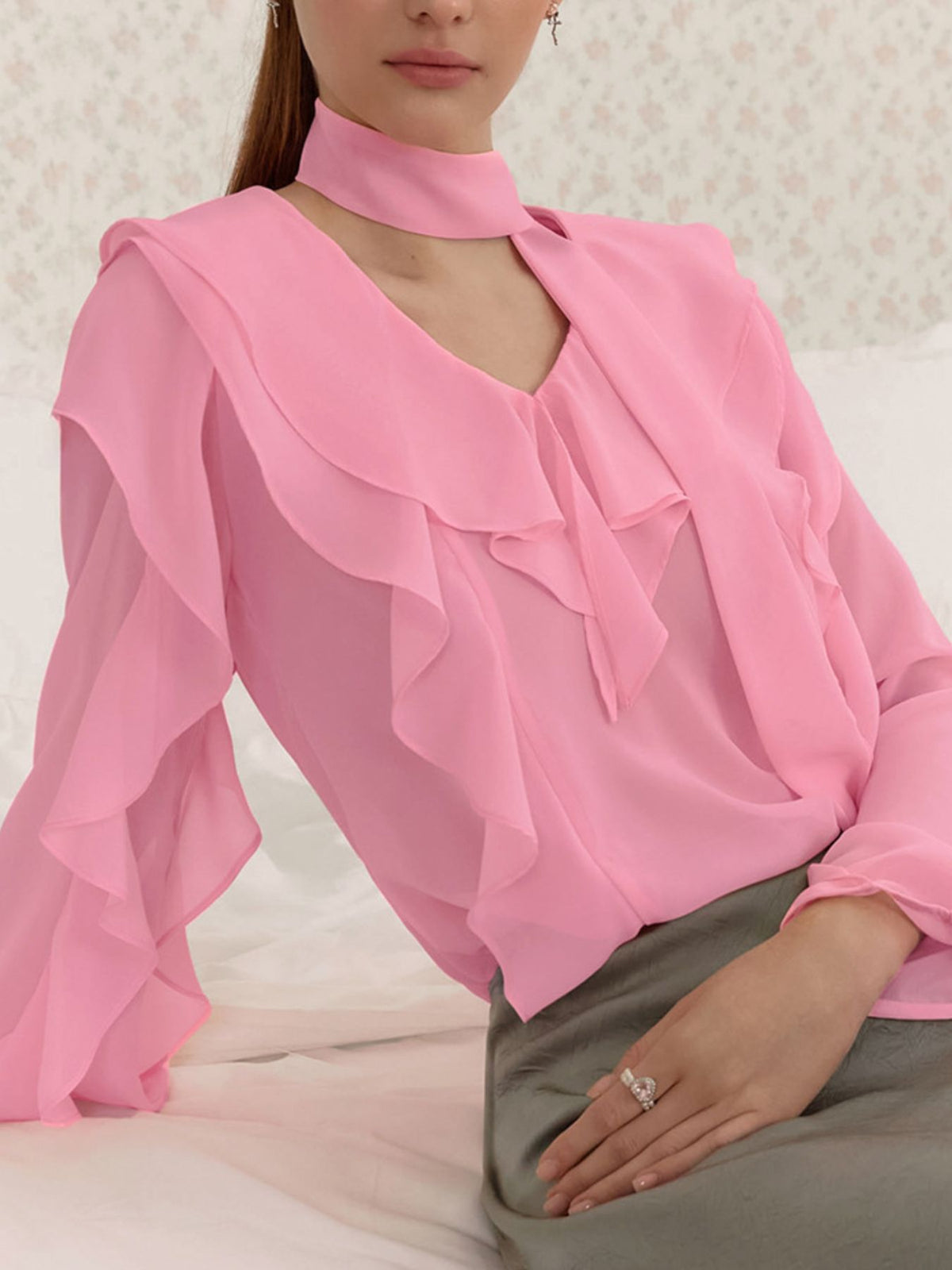 Elegant chiffon blouse with ruffle trim and tie neck from Plush Fashion Hub, featuring a flowy fabric and stylish design.