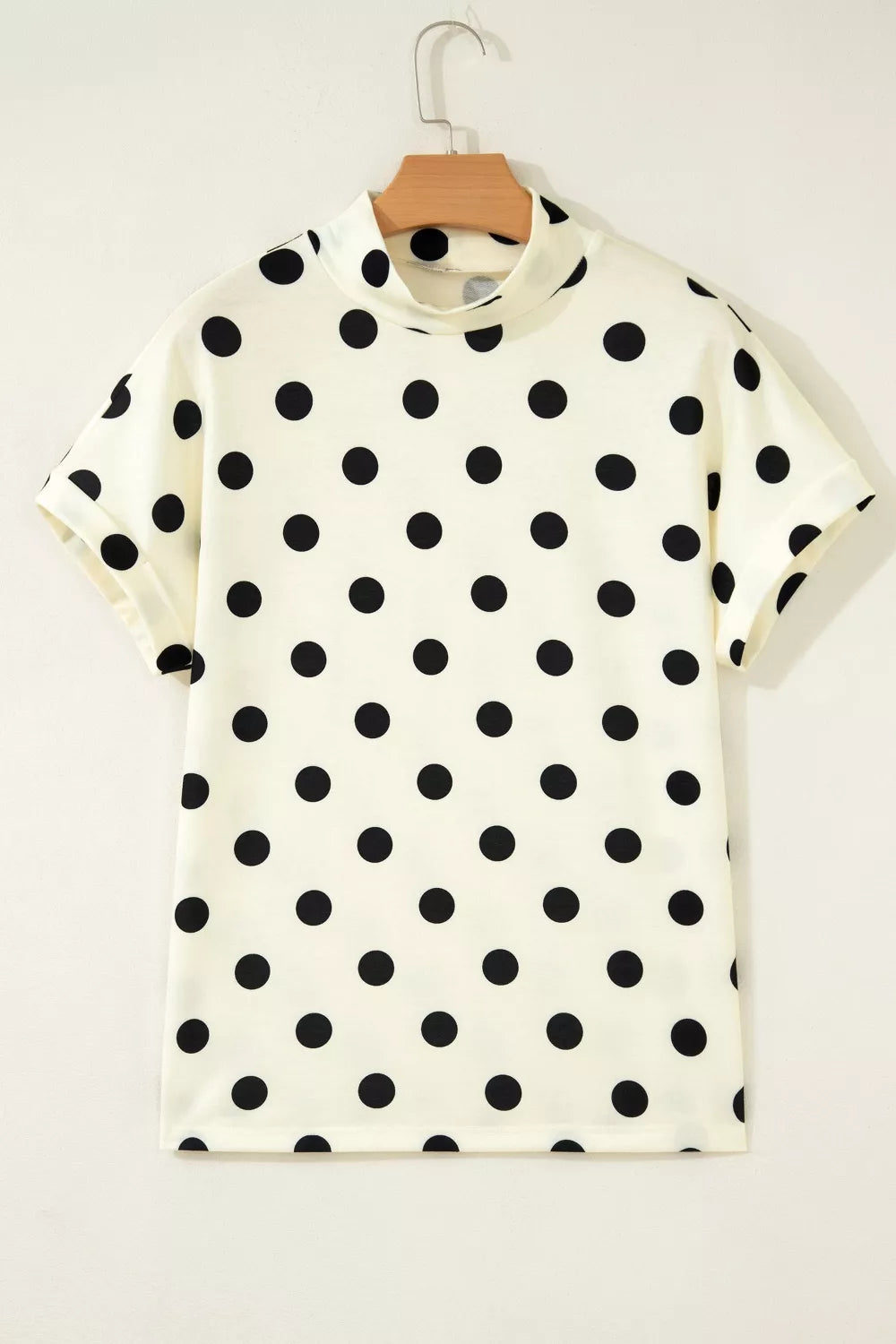 Polka dot print high neck dolman top from Trendsi, featuring a loose fit and stylish design, shown in a front view.