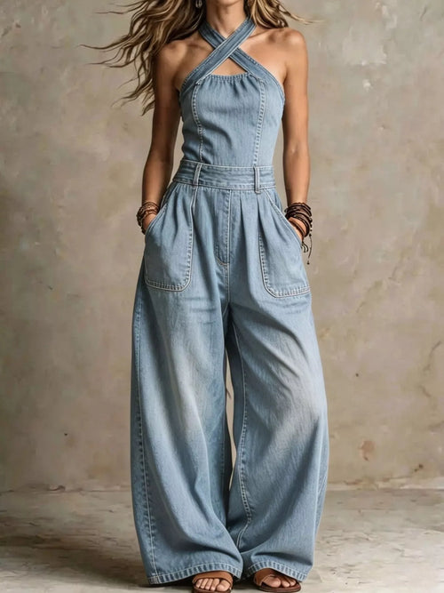 Plus size wide-leg crisscross denim jumpsuit by Trendsi, showcasing the full front view with stylish design details.