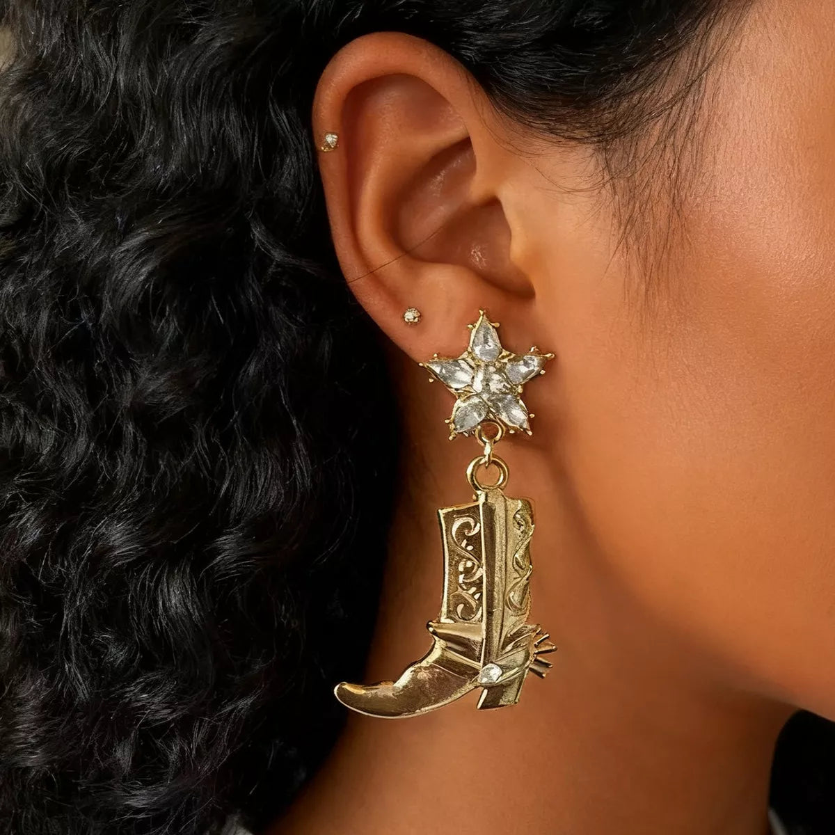 Western style dangle earrings featuring cowboy boot design from Plush Fashion Hub, with intricate details and hanging style.
