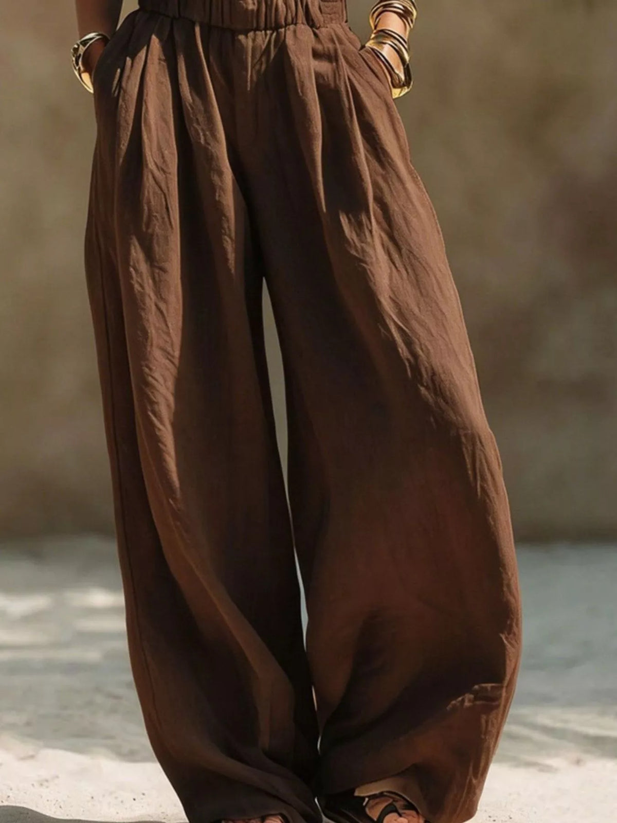Plus size wide leg pants with full elastic waistband from Trendsi, shown in a relaxed fit style on a neutral background.