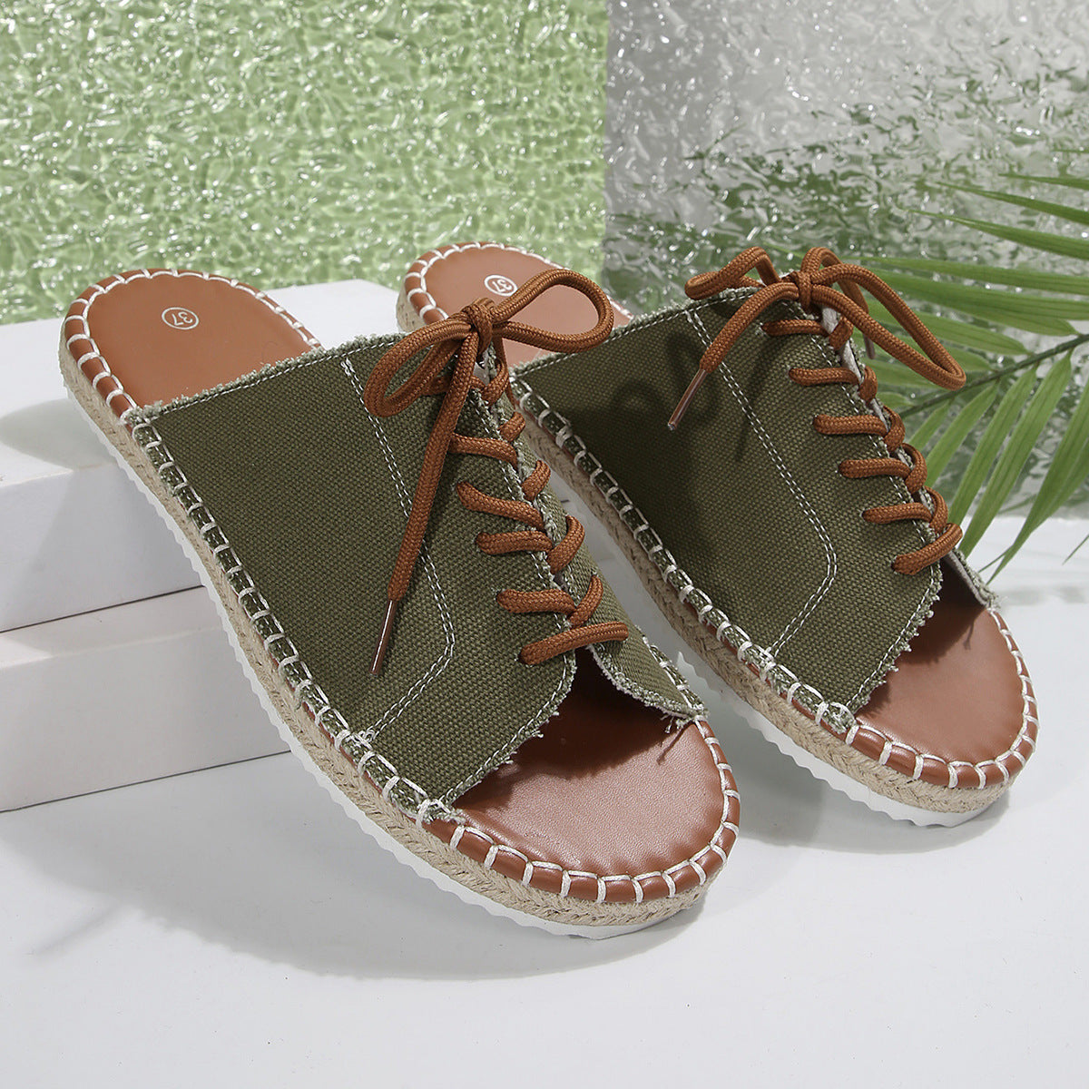 Women’s faux leather lace-up open-toe flat sandals by Plush Fashion Hub, featuring stylish design and open toe detail.