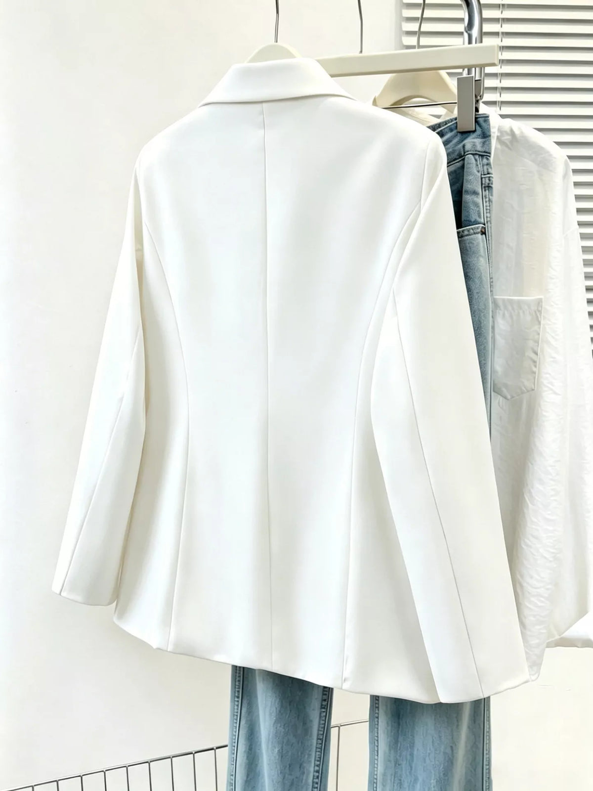 Plus size casual blazer with lapel collar from Trendsi, featuring a single-breasted design and tailored fit.