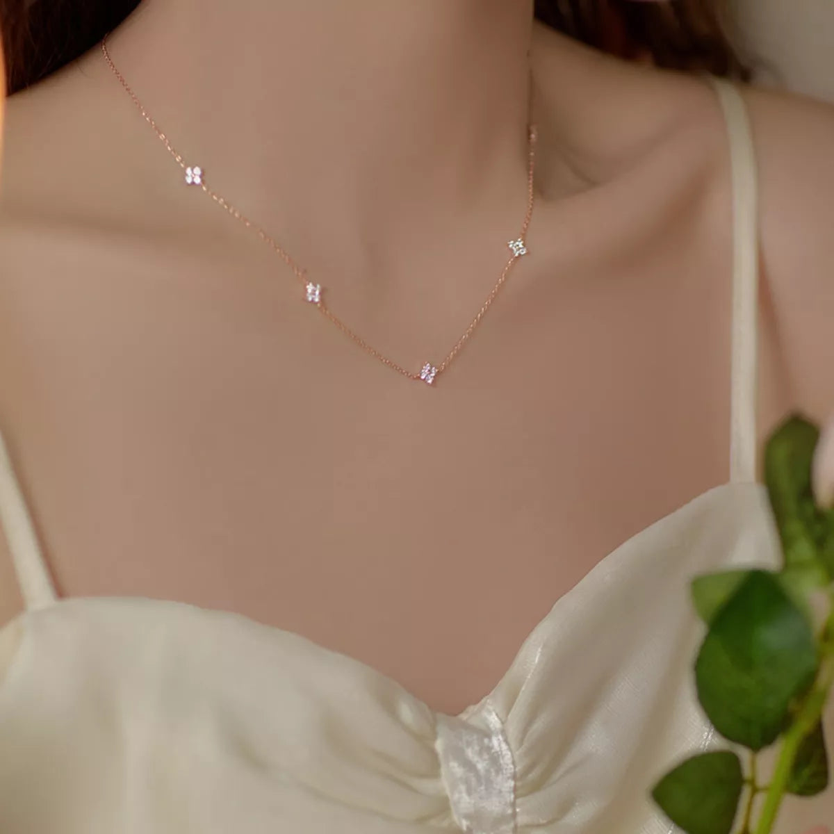 Sterling silver Clover Charm Necklace from Plush Fashion Hub, featuring a delicate four-leaf clover pendant on a fine chain.