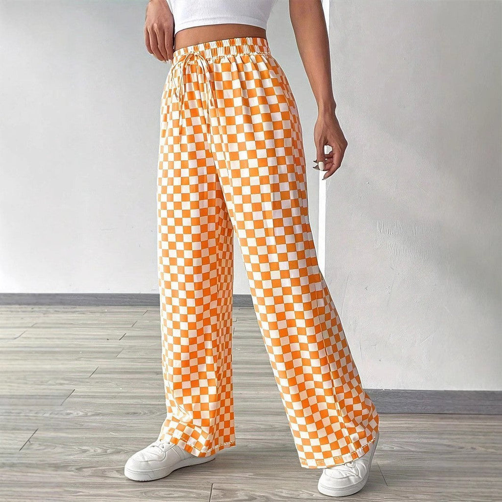 Checkerboard high-waisted wide-leg pants in four colors from Plush Fashion Hub, styled on a model with pockets and bold pattern.