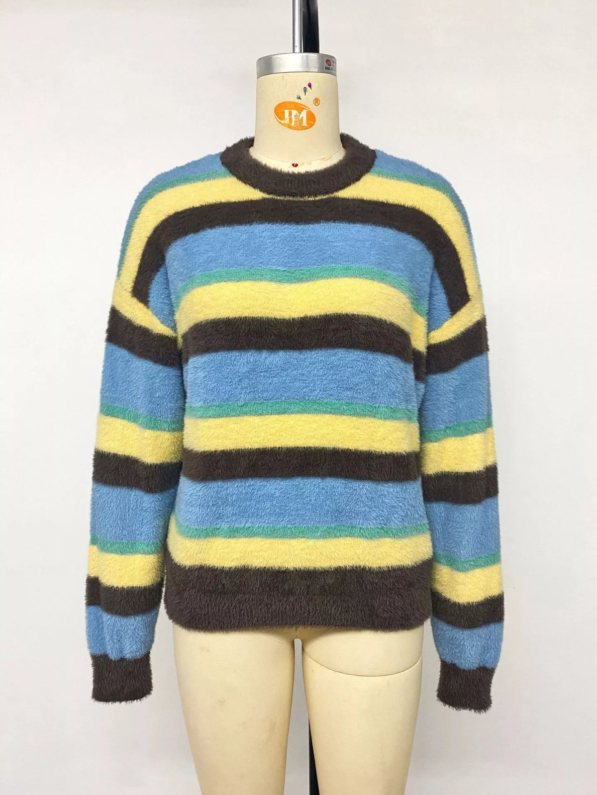 Striped dropped shoulder sweater by Trendsi featuring bold horizontal stripes and a relaxed fit, displayed on a model.
