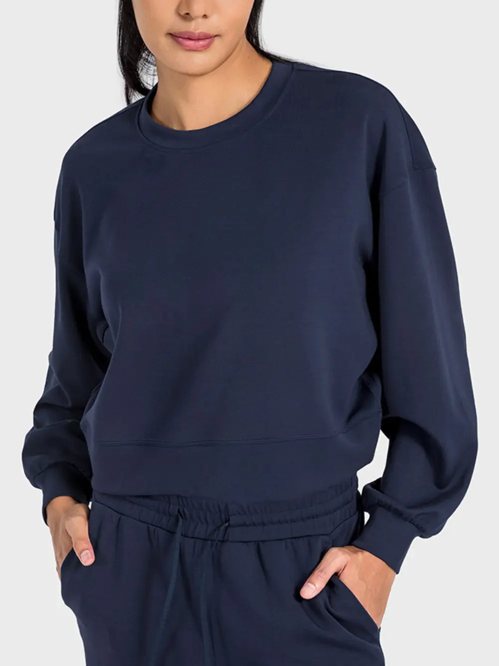 Plush Fashion Hub Millennia round neck drop shoulder sports top in soft fabric, designed for comfortable activewear.