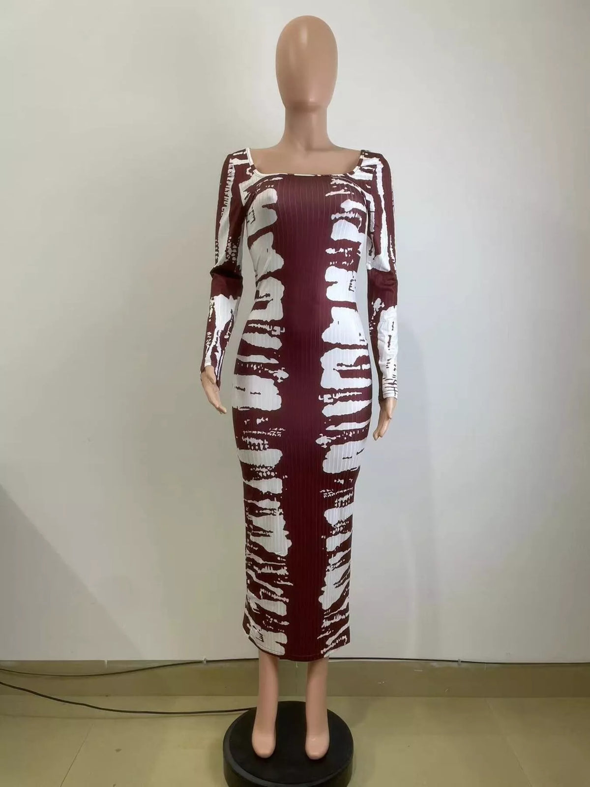 Colorful tie-dye long sleeve maxi dress from Plush Fashion Hub, flowing fabric with vibrant patterns and a comfortable fit.