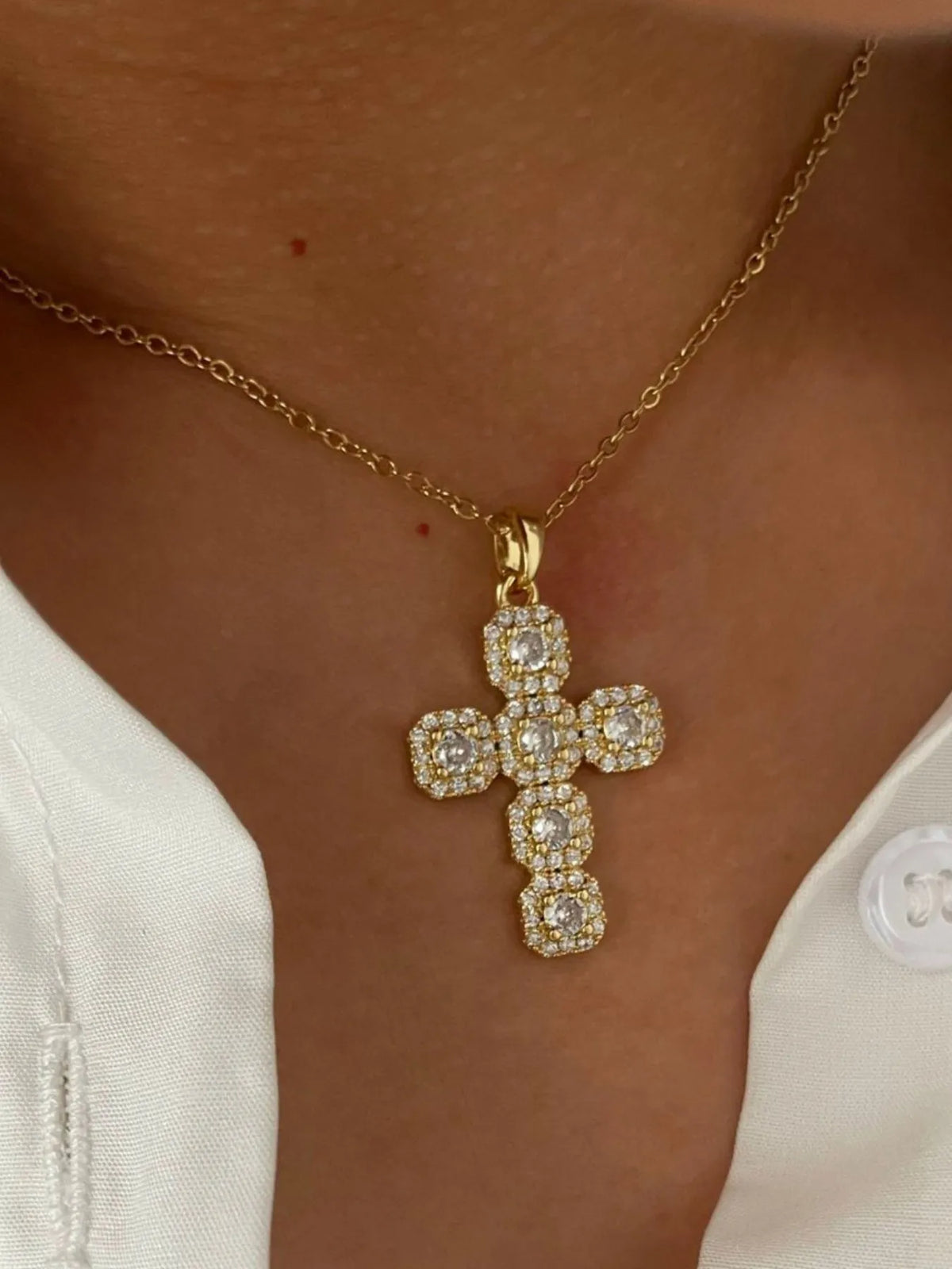Stainless steel cross necklace with inlaid zircon stones, jewelry from Plush Fashion Hub featuring a sleek and elegant design.