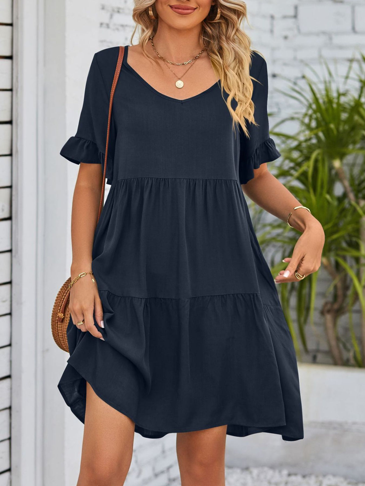 Lightweight rayon ruffled sleeve tiered mini dress with pockets from Plush Fashion Hub, featuring a flowy design and feminine details.