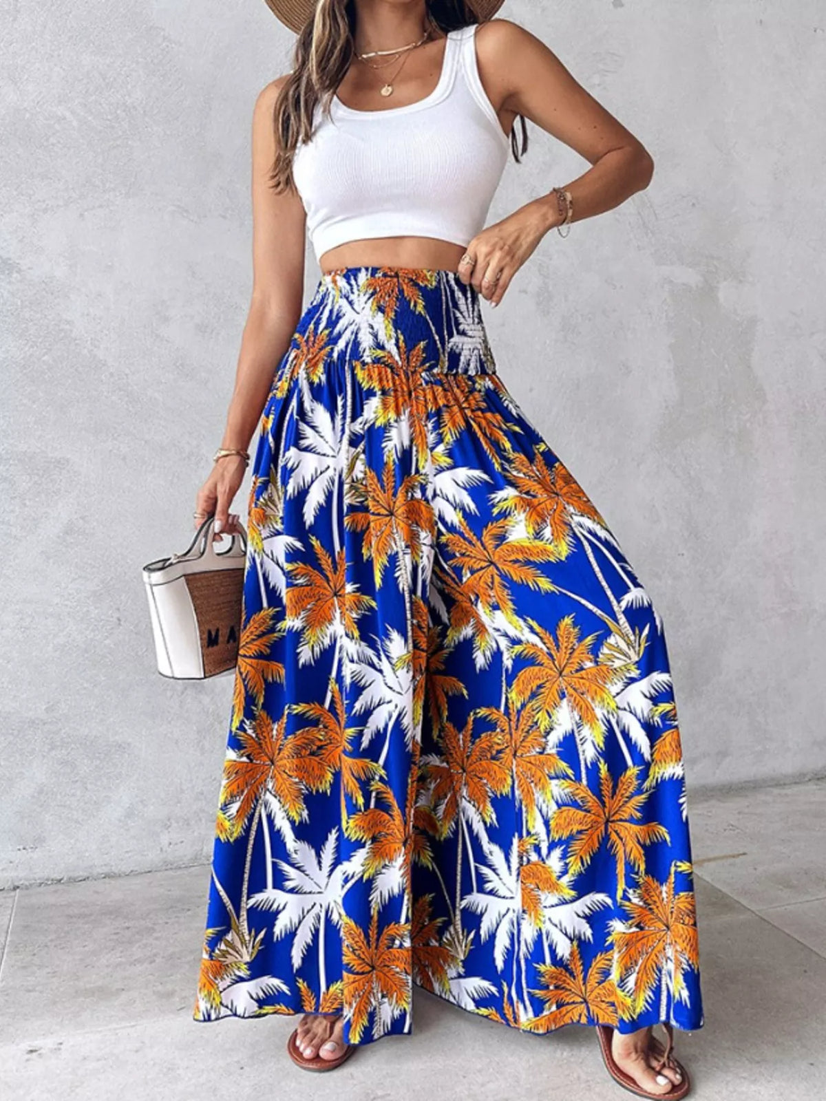 Printed wide-leg pants by Plush Fashion Hub featuring colorful floral patterns and a relaxed fit.