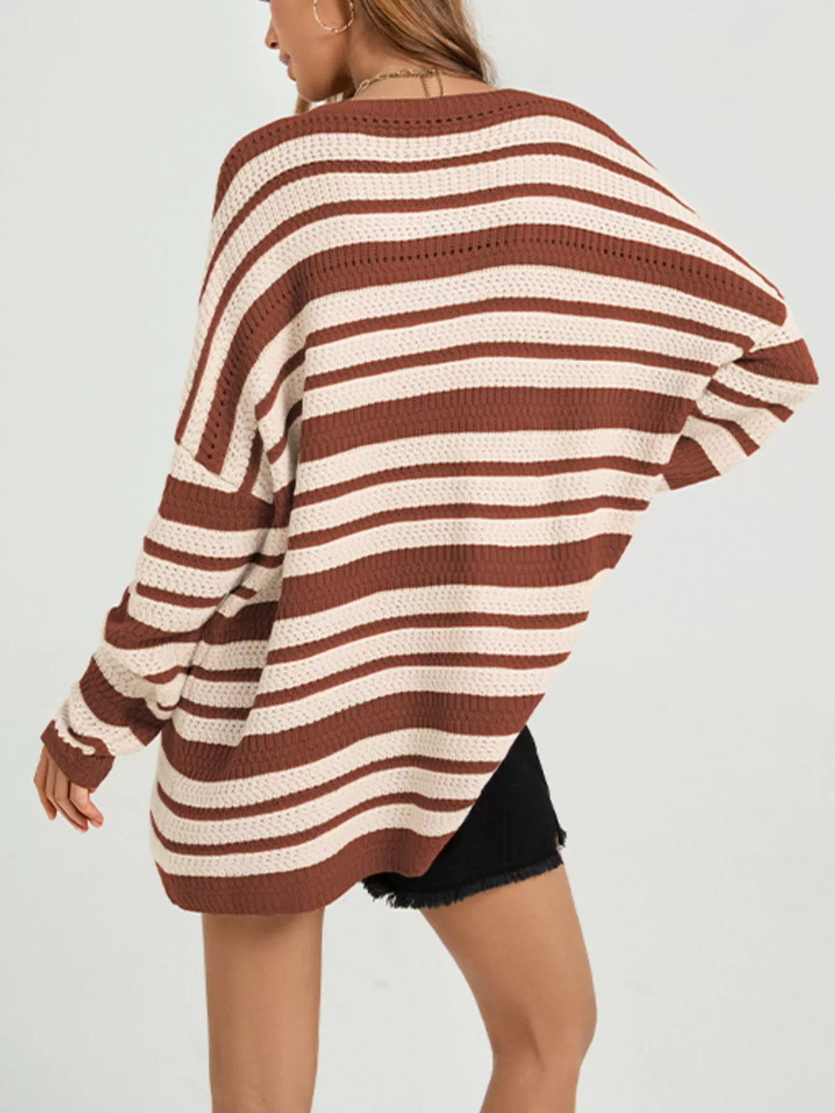 Trendsi striped drop shoulder sweater for women, featuring a cozy knit fabric and relaxed fit with bold stripe pattern.