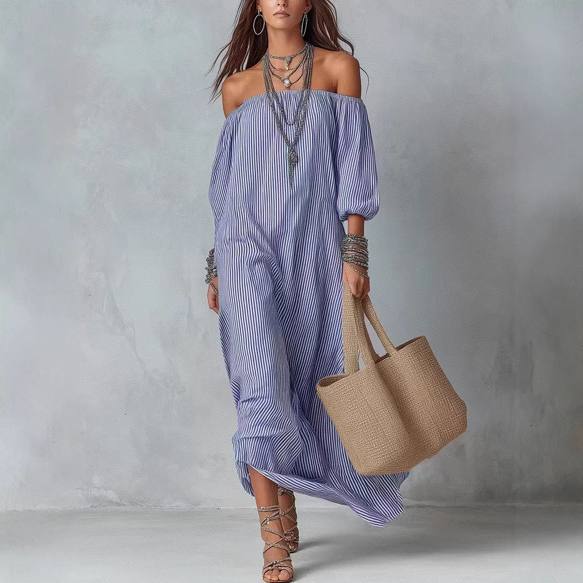 Women's striped loose-fit flared maxi dress by FitiqueFit, featuring a flowing design perfect for holiday and vacation wear.