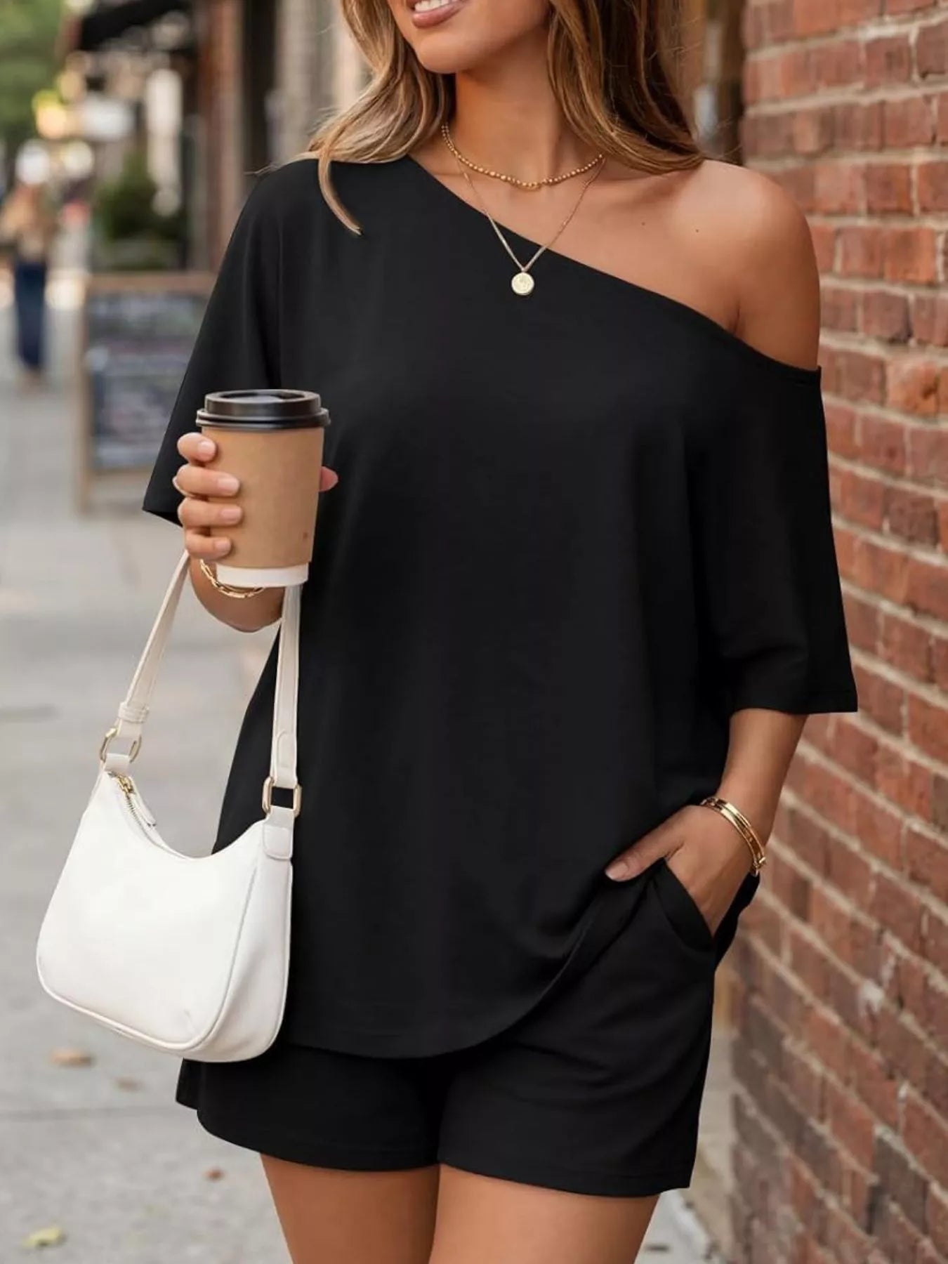 Plus size one shoulder top and shorts set by Trendsi, featuring a stylish, full-size design with a modern, casual look.