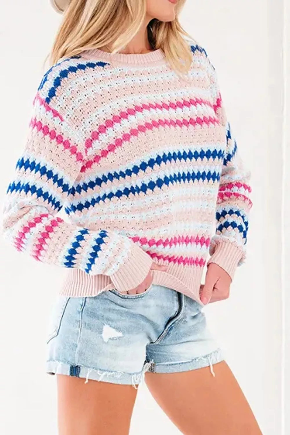 Women's striped geometric pattern sweater from Trendsi, featuring a stylish design with bold colors and cozy knit fabric.