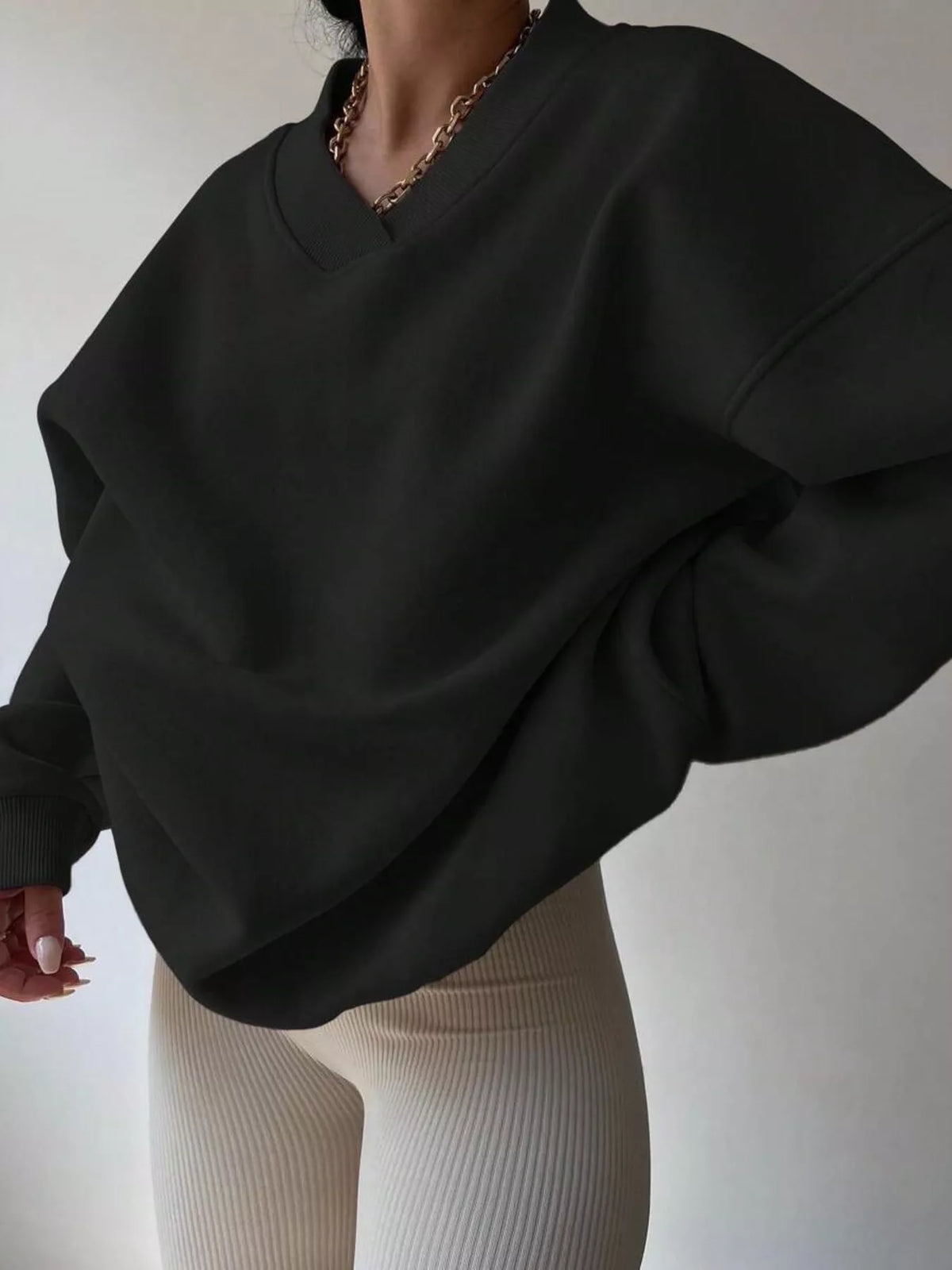 Oversized dropped shoulder long sleeve sweatshirt by Trendsi, soft fabric, relaxed fit, in neutral color, front view image.