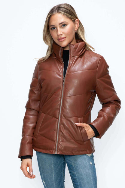 Pocketed zip up puffer jacket with removable hood in brown pleather.