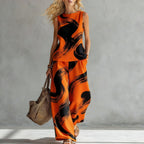 Women's sleeveless printed tank top and wide-leg pants two-piece casualwear set by Plush Fashion Hub, featuring vibrant patterns.