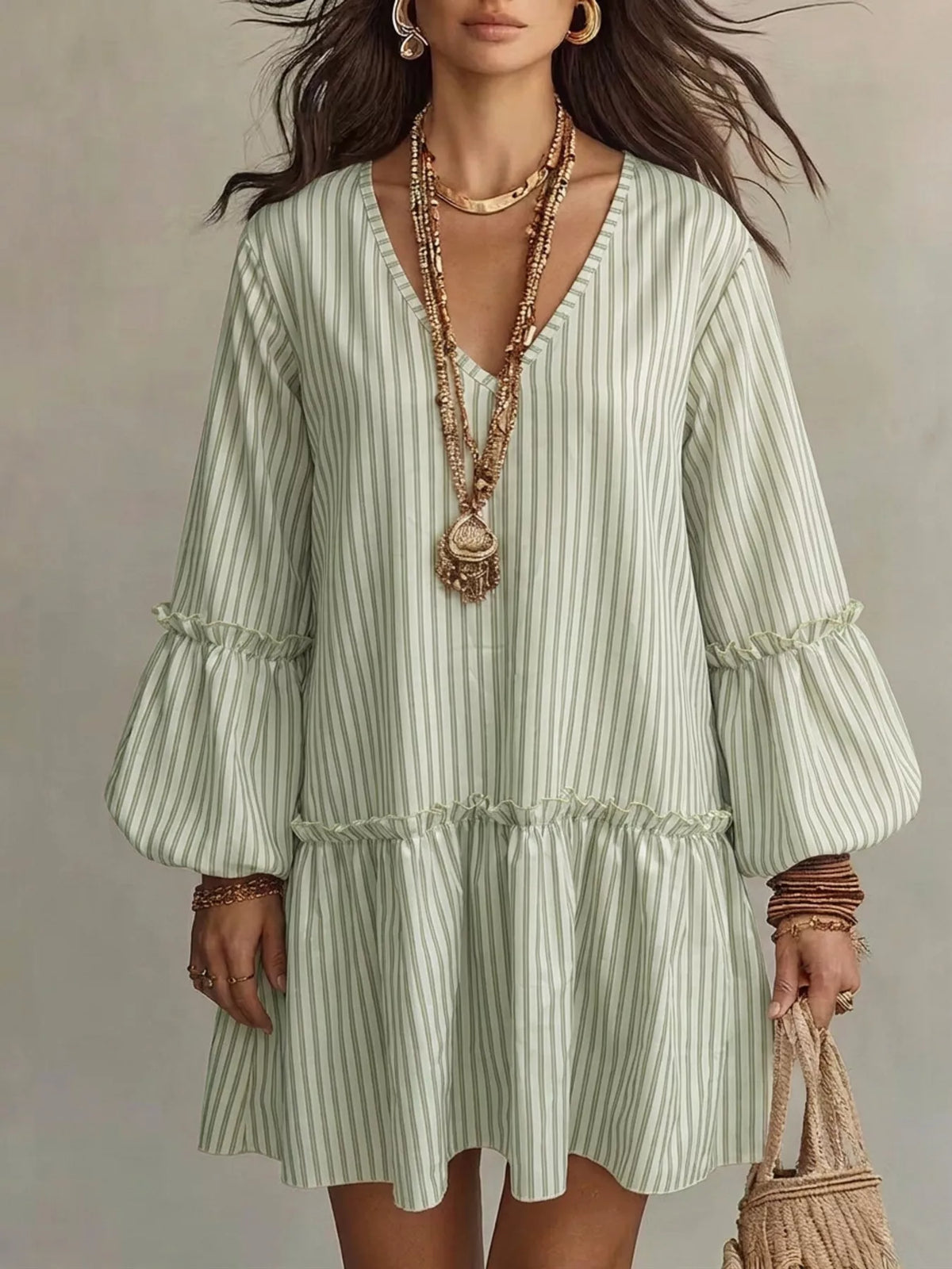Plus size striped balloon sleeve mini dress by Trendsi, featuring a stylish fit and bold pattern, shown on a model.