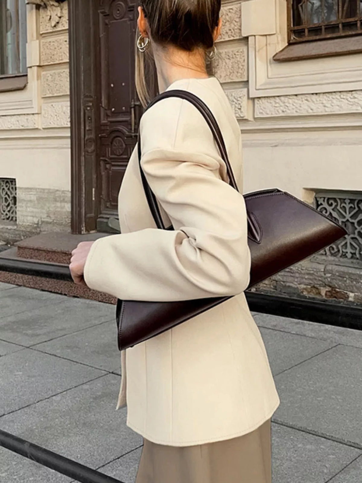 Trendsi women's V-neck button-up blazer with structured shoulders, tailored fit, and classic design for professional or stylish wear.