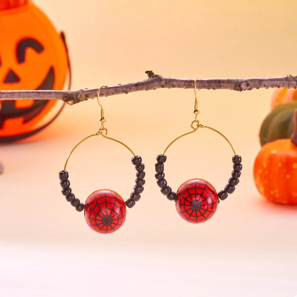 Gold-plated Halloween bead earrings by Plush Fashion Hub featuring spooky-themed beads and stylish dangling design.