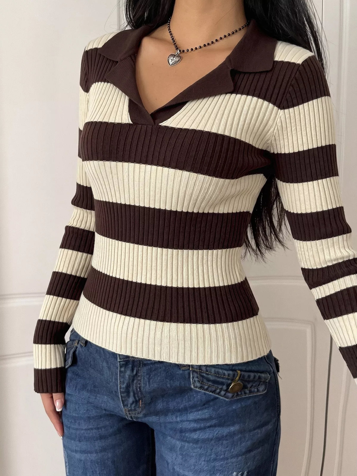 Striped ribbed knit long sleeve sweater shirt by Plush Fashion Hub, featuring a fitted design and cozy fabric in a stylish pattern.