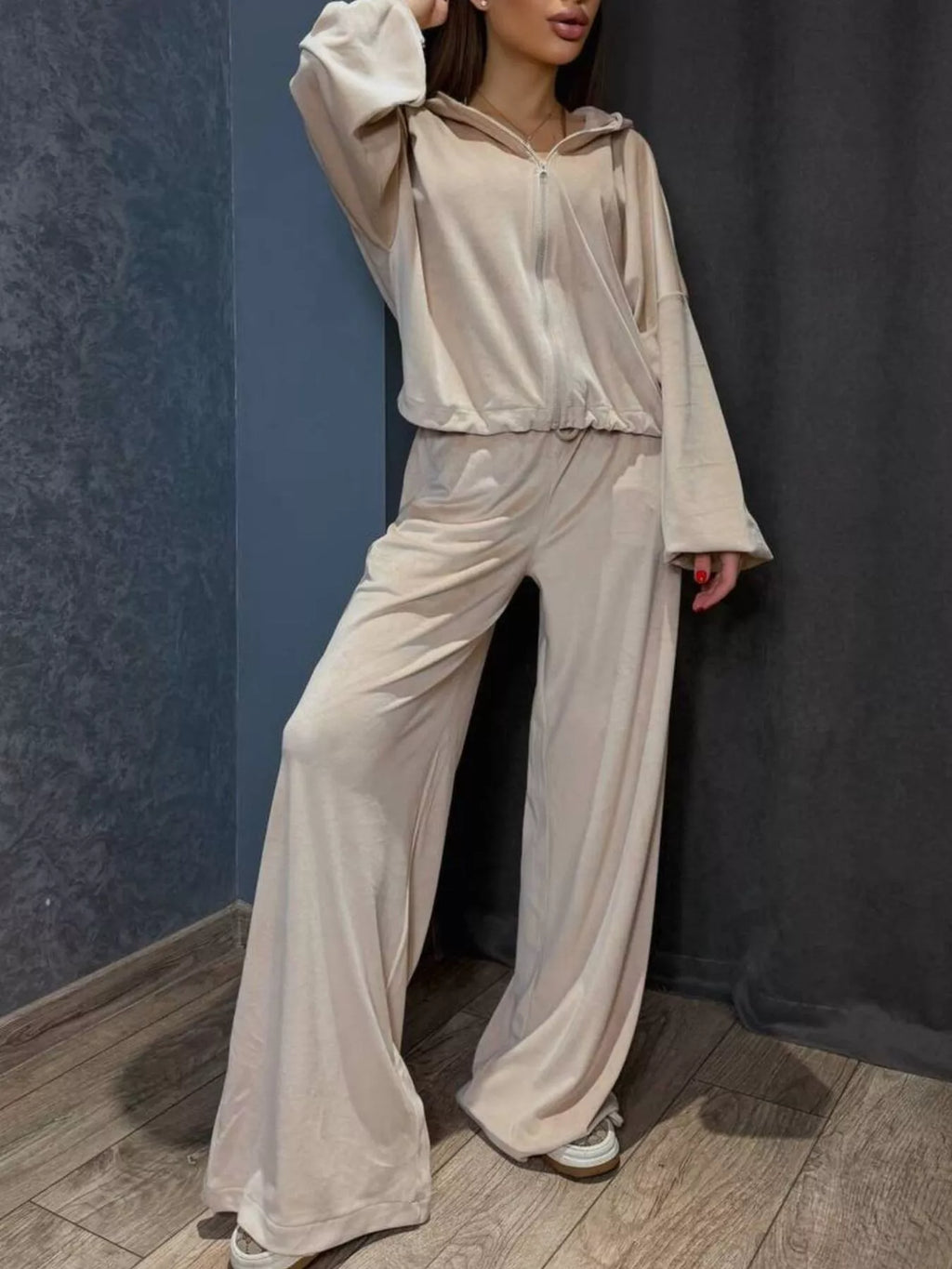 Trendsi zip-up cropped outerwear and pants set, stylish and casual, shown on a model in a modern indoor setting